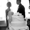 Couple behind cake image